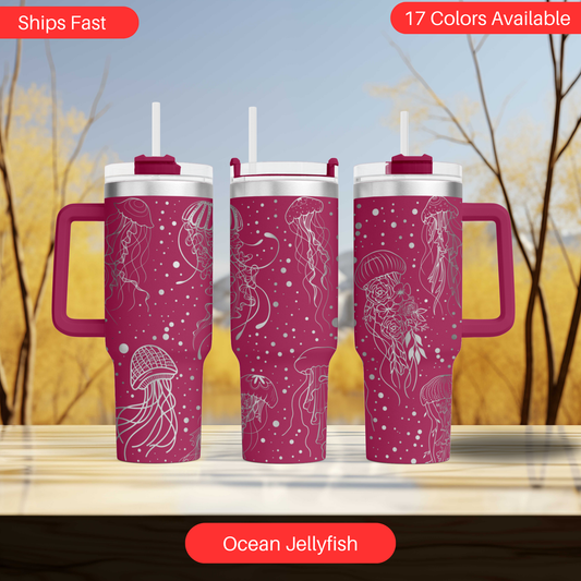 a set of three travel mugs sitting on top of a table