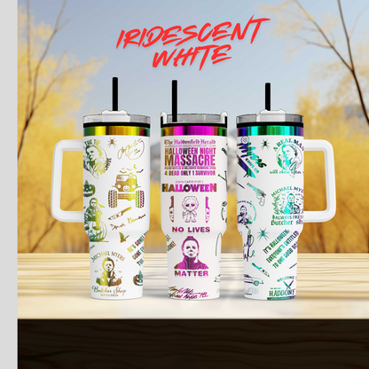 three travel mugs sitting on top of a wooden table