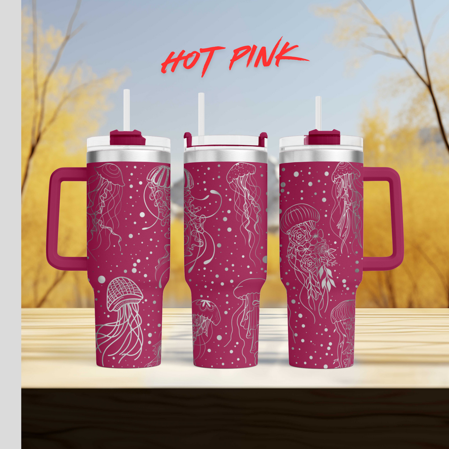 three pink coffee mugs sitting on top of a wooden table