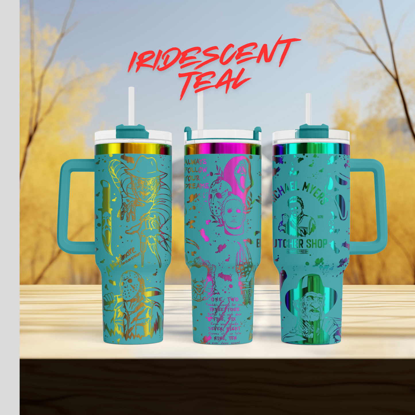 a set of three travel mugs sitting on top of a table