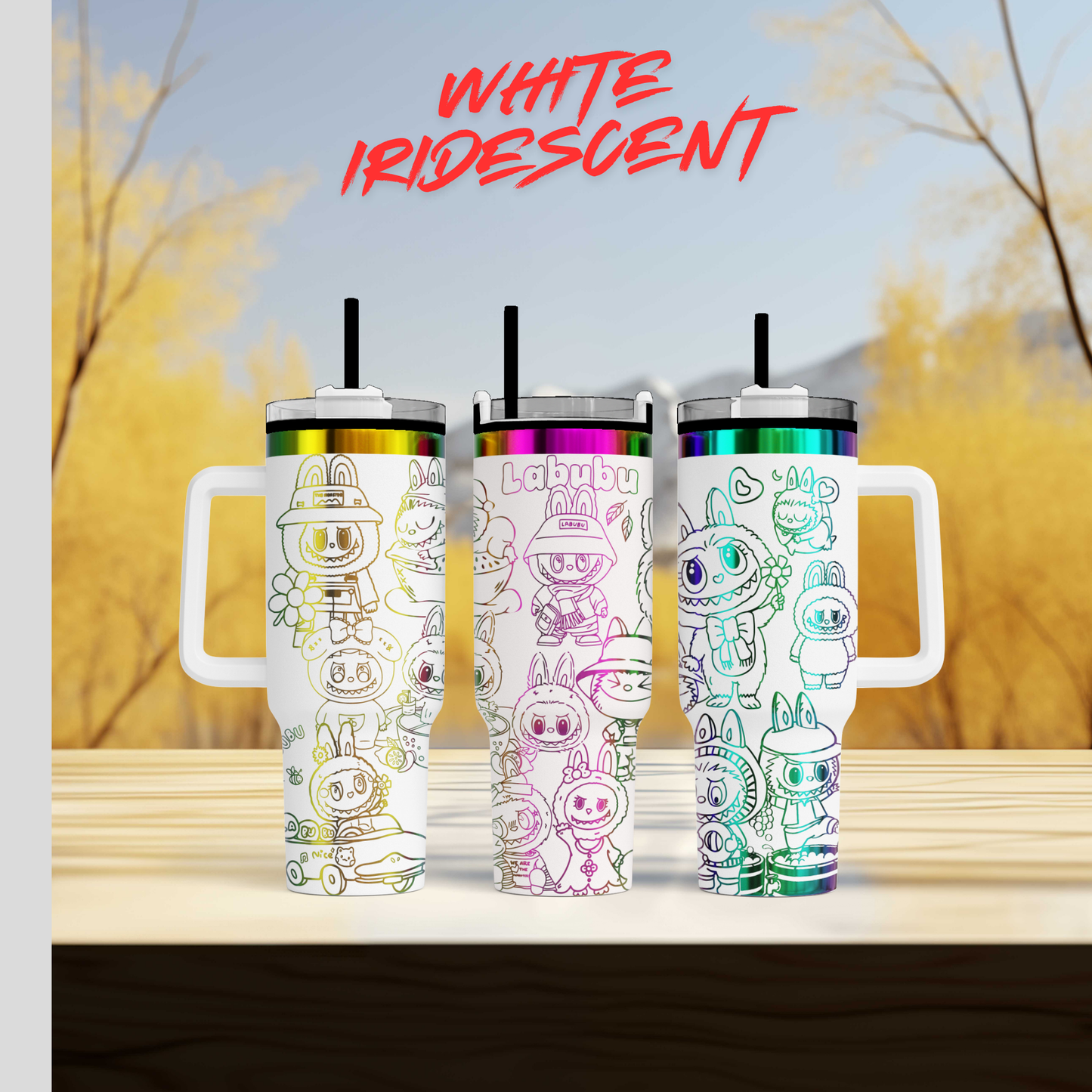 Three colorful tumblers with various cartoon-style characters printed on them, set against a blurred background of trees and sky.