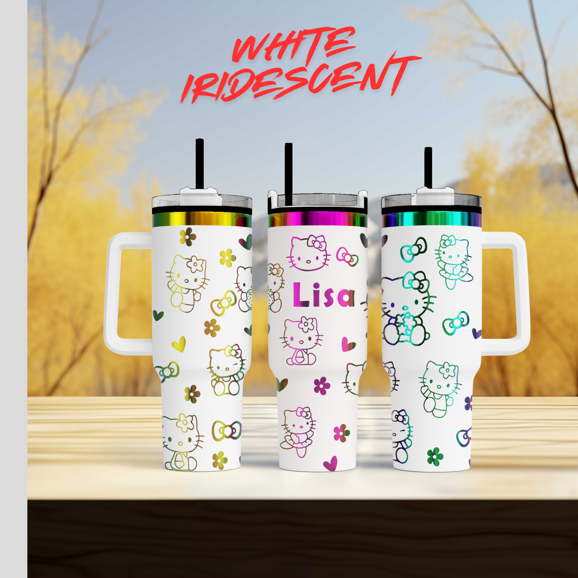 Three Hello Kitty tumblers with personalized names on them, set against a blurred background of trees.
