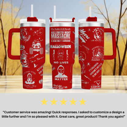 three red travel mugs sitting on top of a table