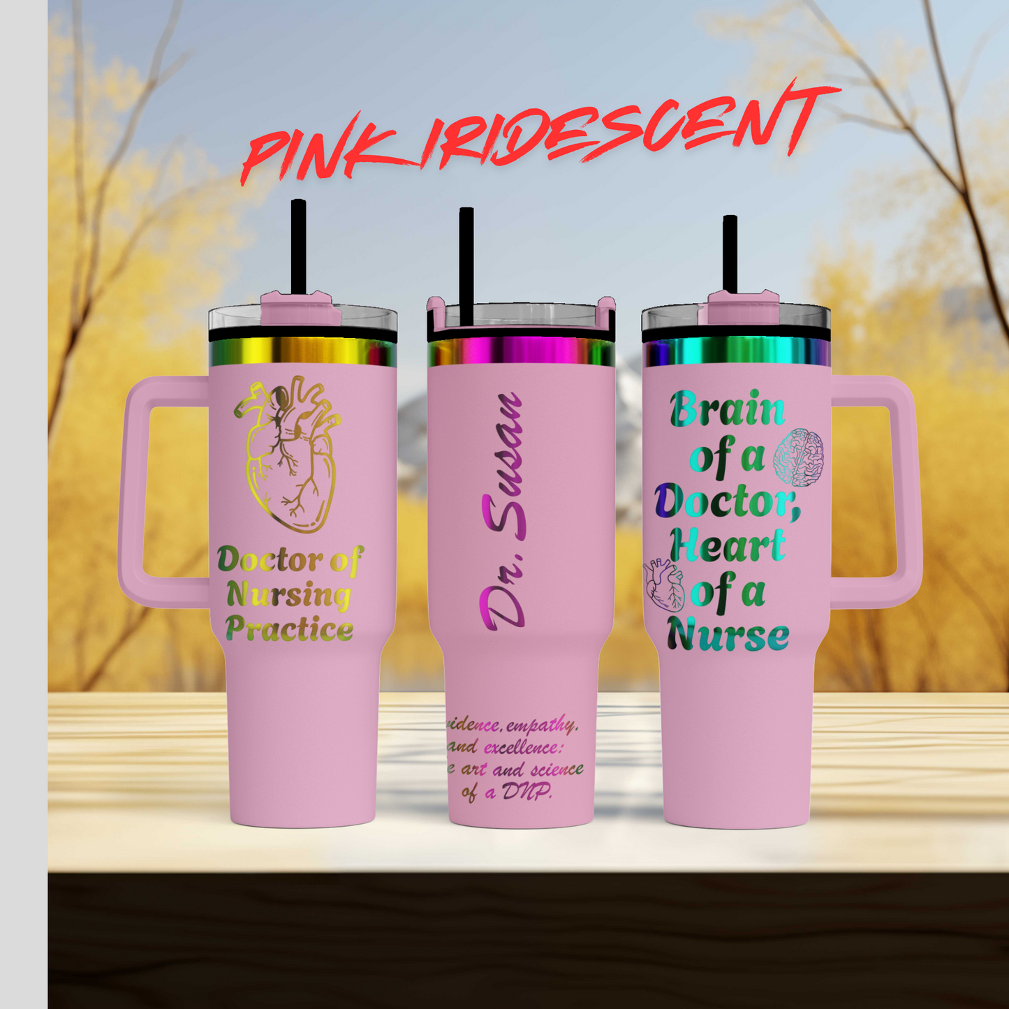 three pink travel mugs sitting on top of a wooden table