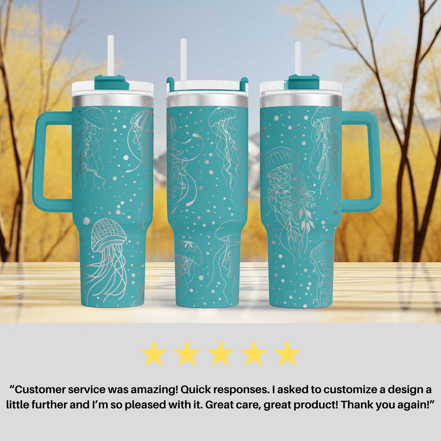 three travel mugs sitting on top of a table
