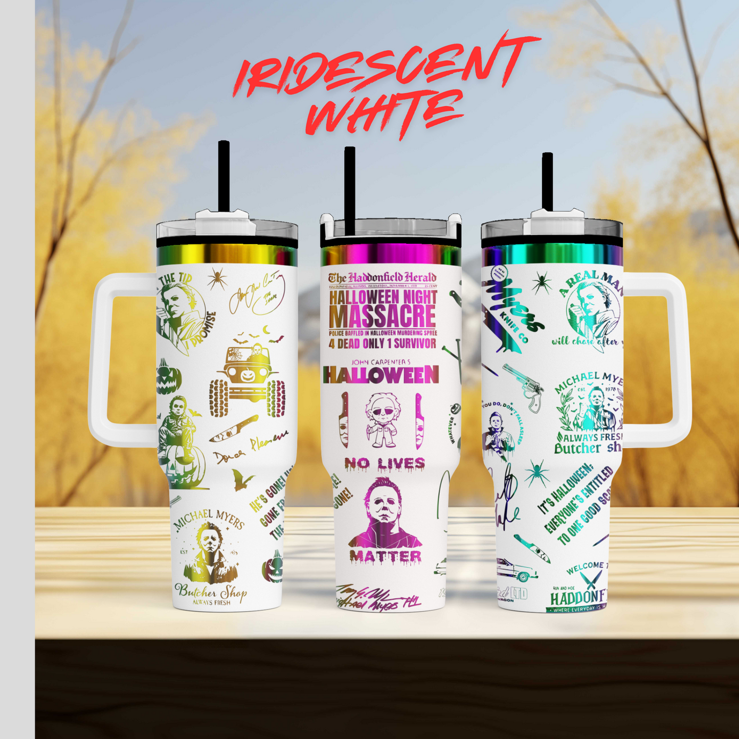 three travel mugs sitting on top of a wooden table
