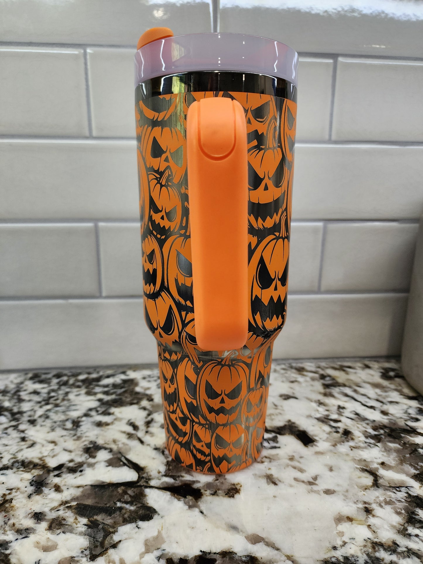 a close up of an orange and black brush