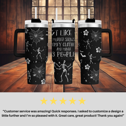 a couple of coffee mugs sitting on top of a wooden table