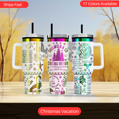 Three colorful tumblers with various designs and text, including Christmas-themed elements, are displayed on a wooden surface against a blurred background.