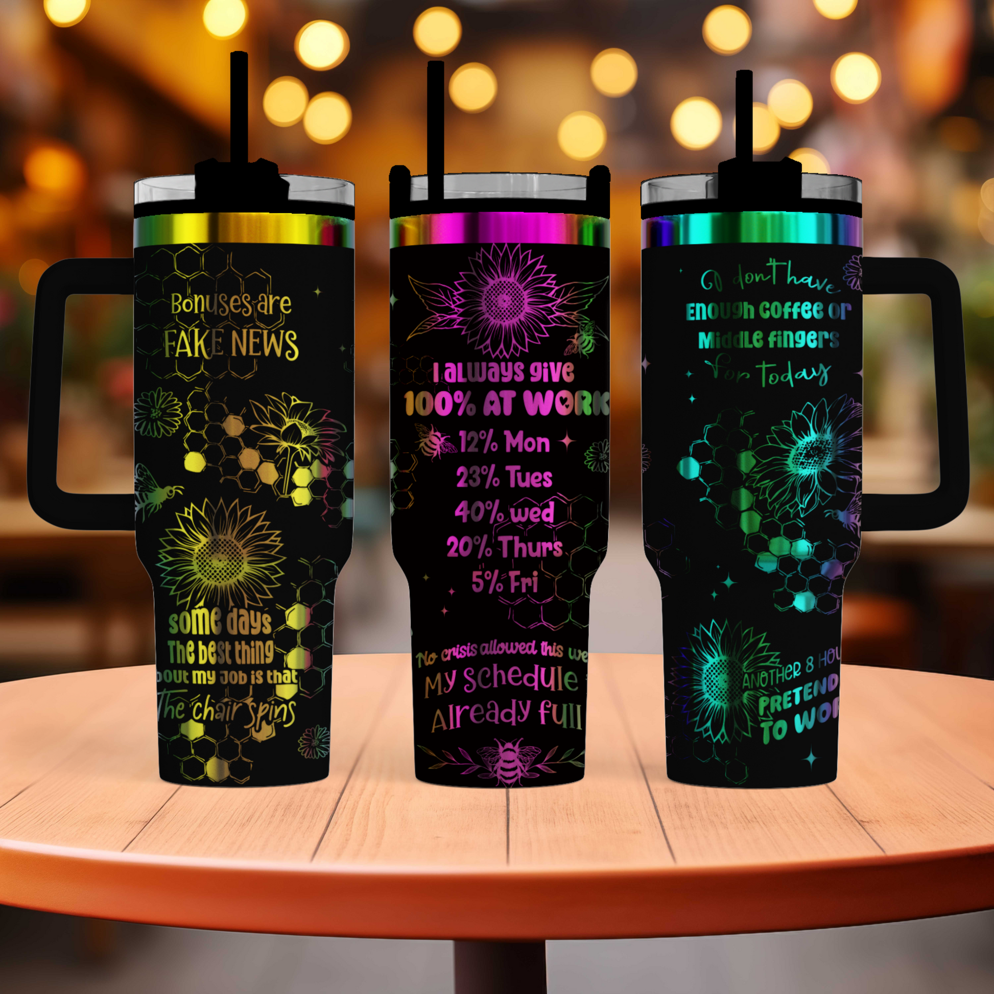 three travel mugs sitting on top of a table