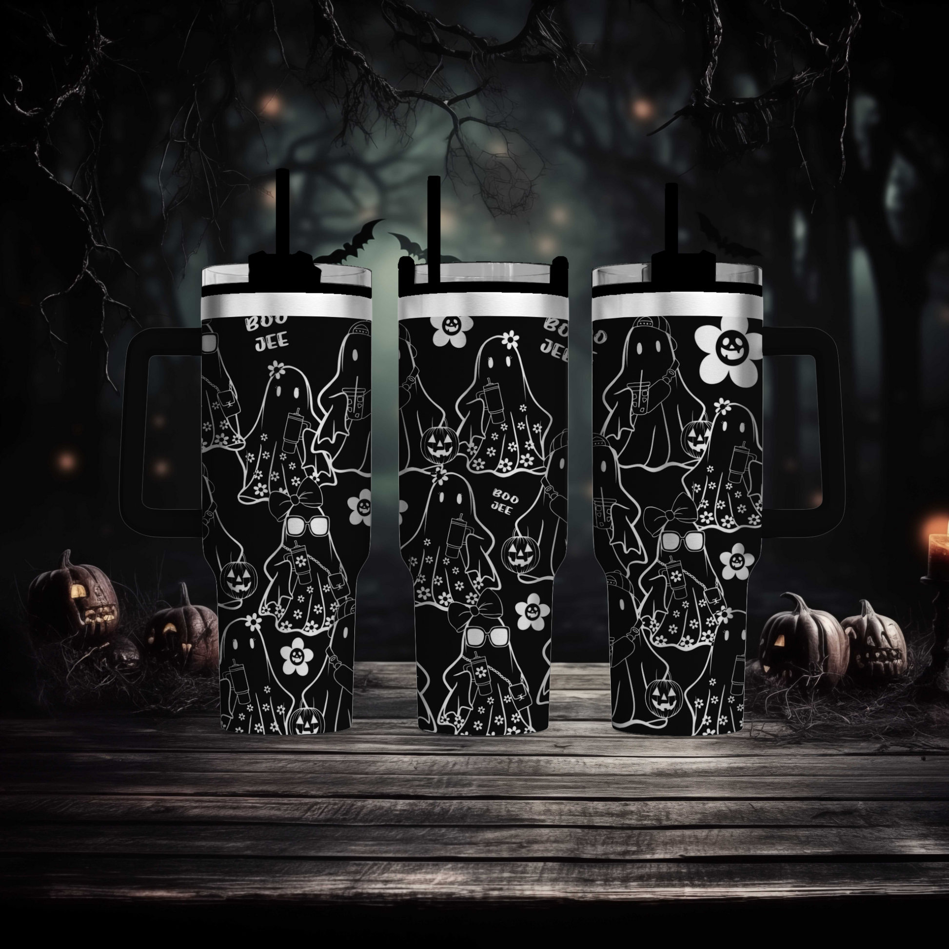 a couple of black mugs sitting on top of a wooden table