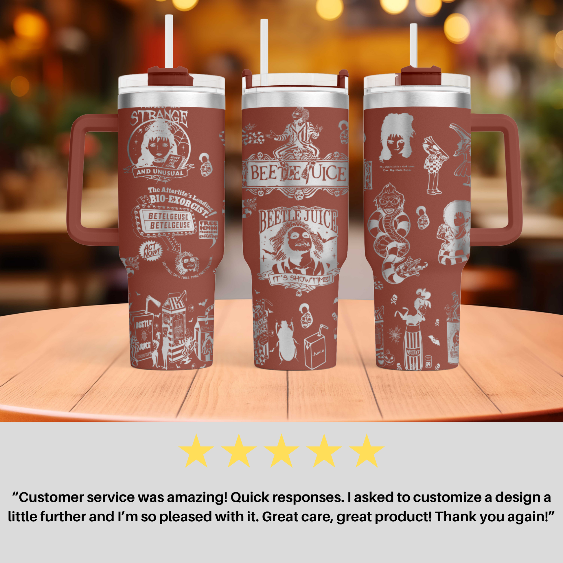 three travel mugs sitting on top of a wooden table