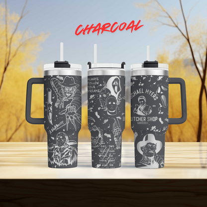 three travel mugs sitting on top of a wooden table