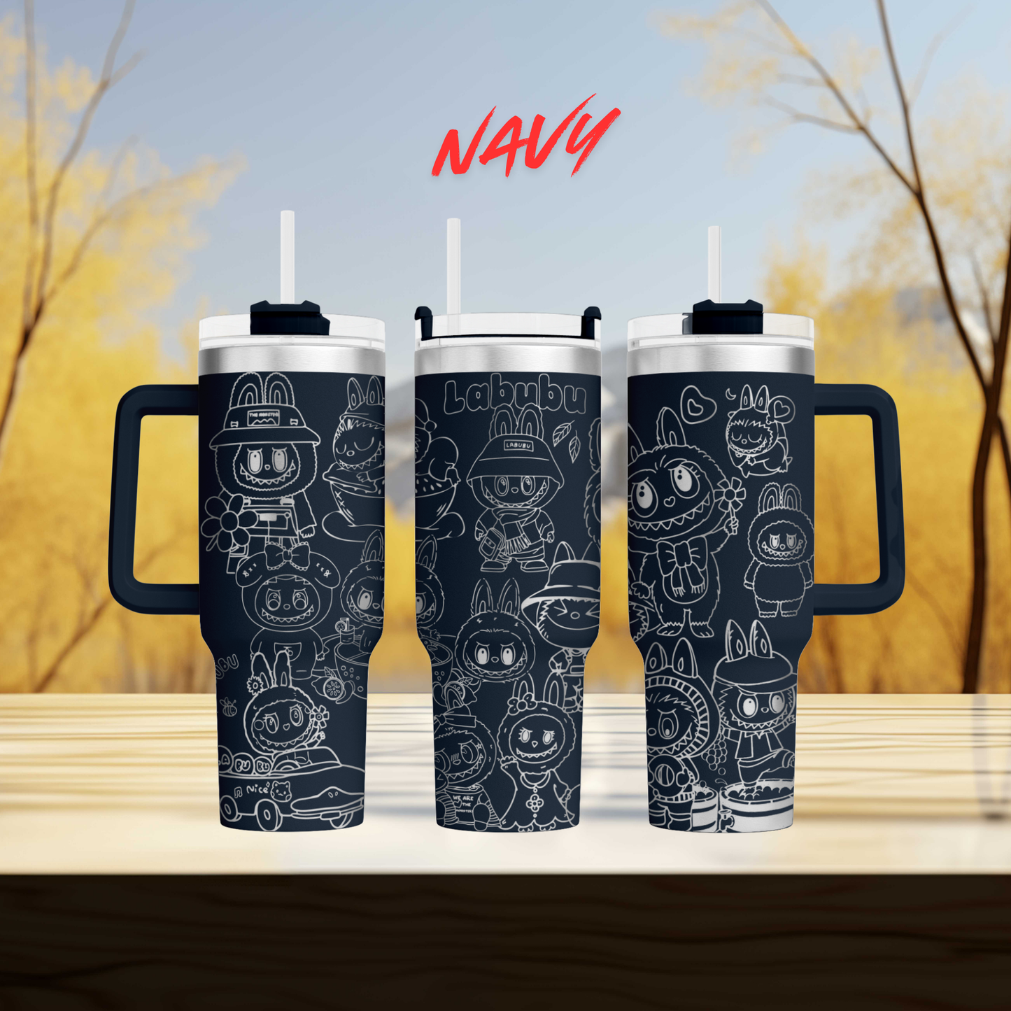 three black tumblers with white cartoon rabbit designs on them, set against a blurred background of trees.