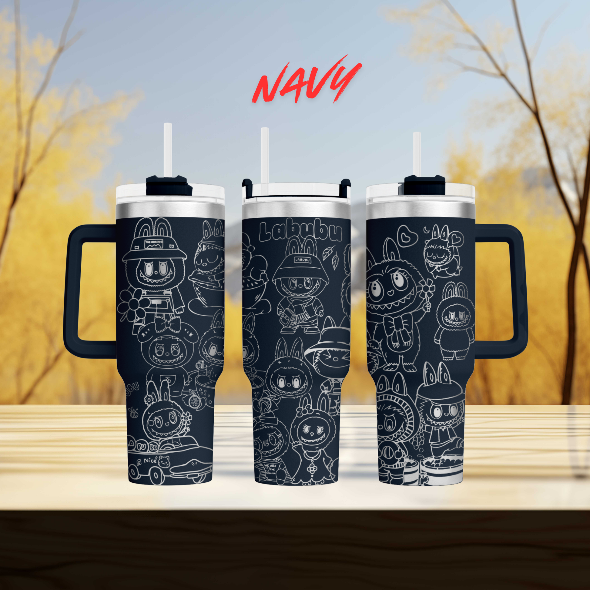 three black tumblers with white cartoon rabbit designs on them, set against a blurred background of trees.