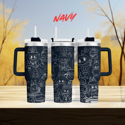 three black tumblers with white cartoon rabbit designs on them, set against a blurred background of trees.