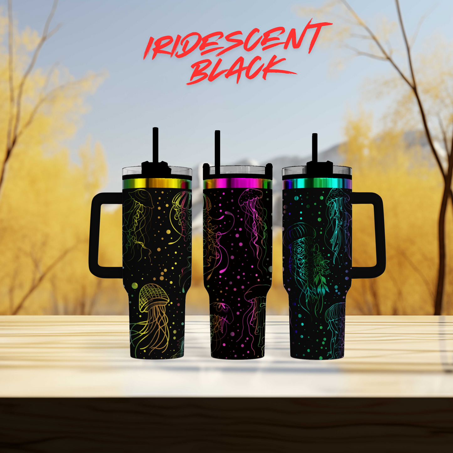 three colorful tumblers sitting on top of a wooden table