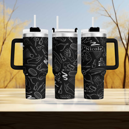 a couple of black coffee mugs sitting on top of a wooden table