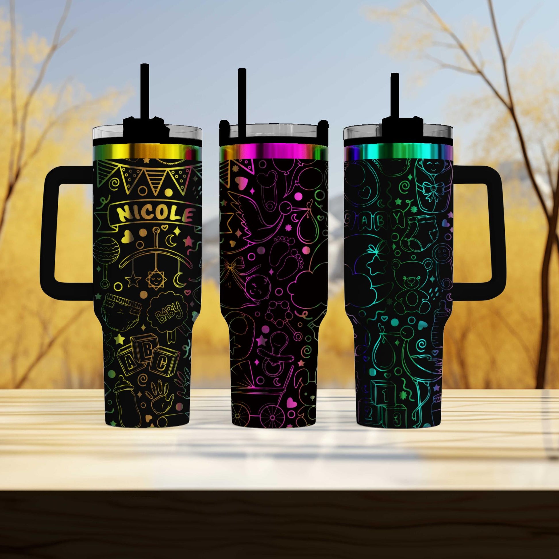 three travel mugs sitting on top of a wooden table