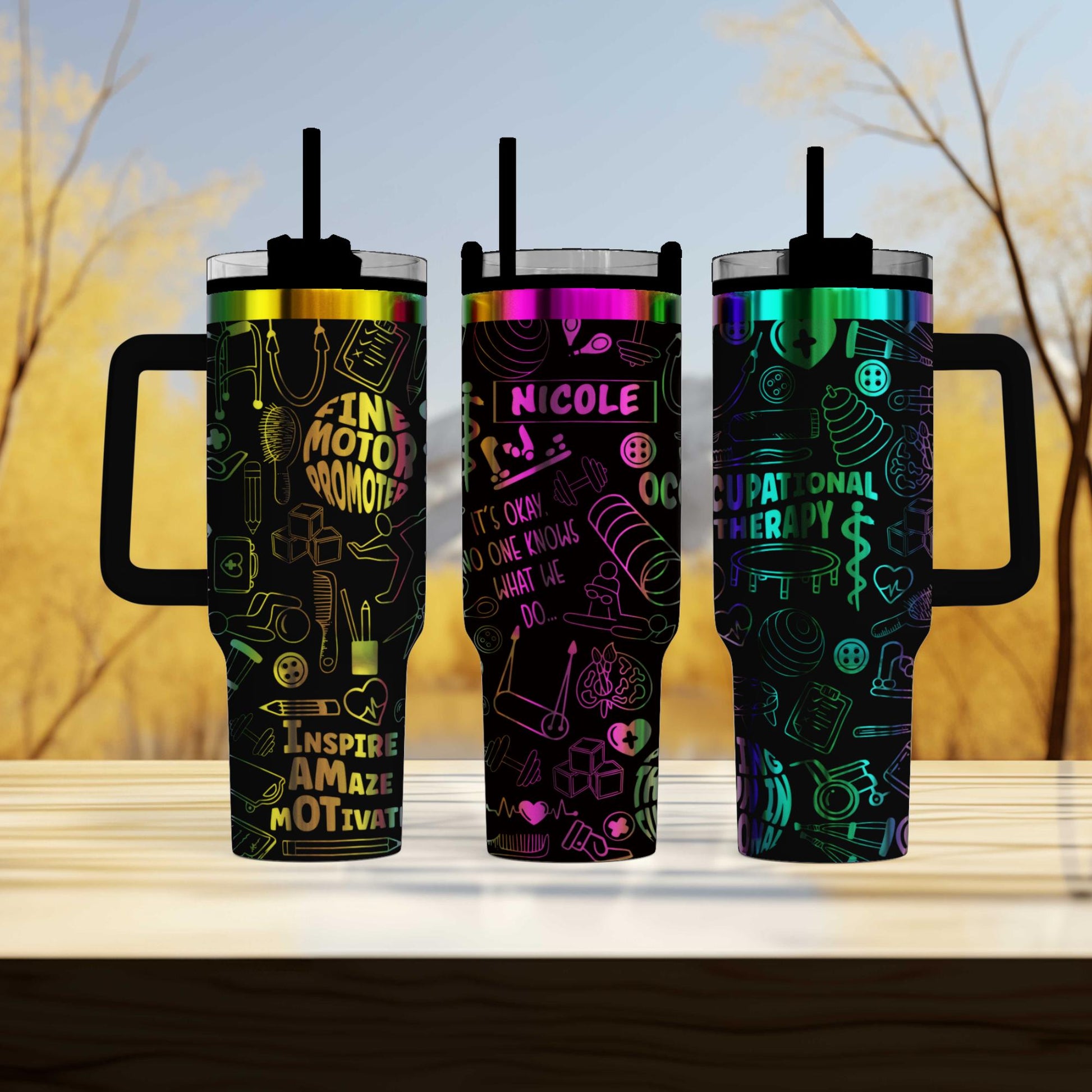three travel mugs sitting on top of a wooden table