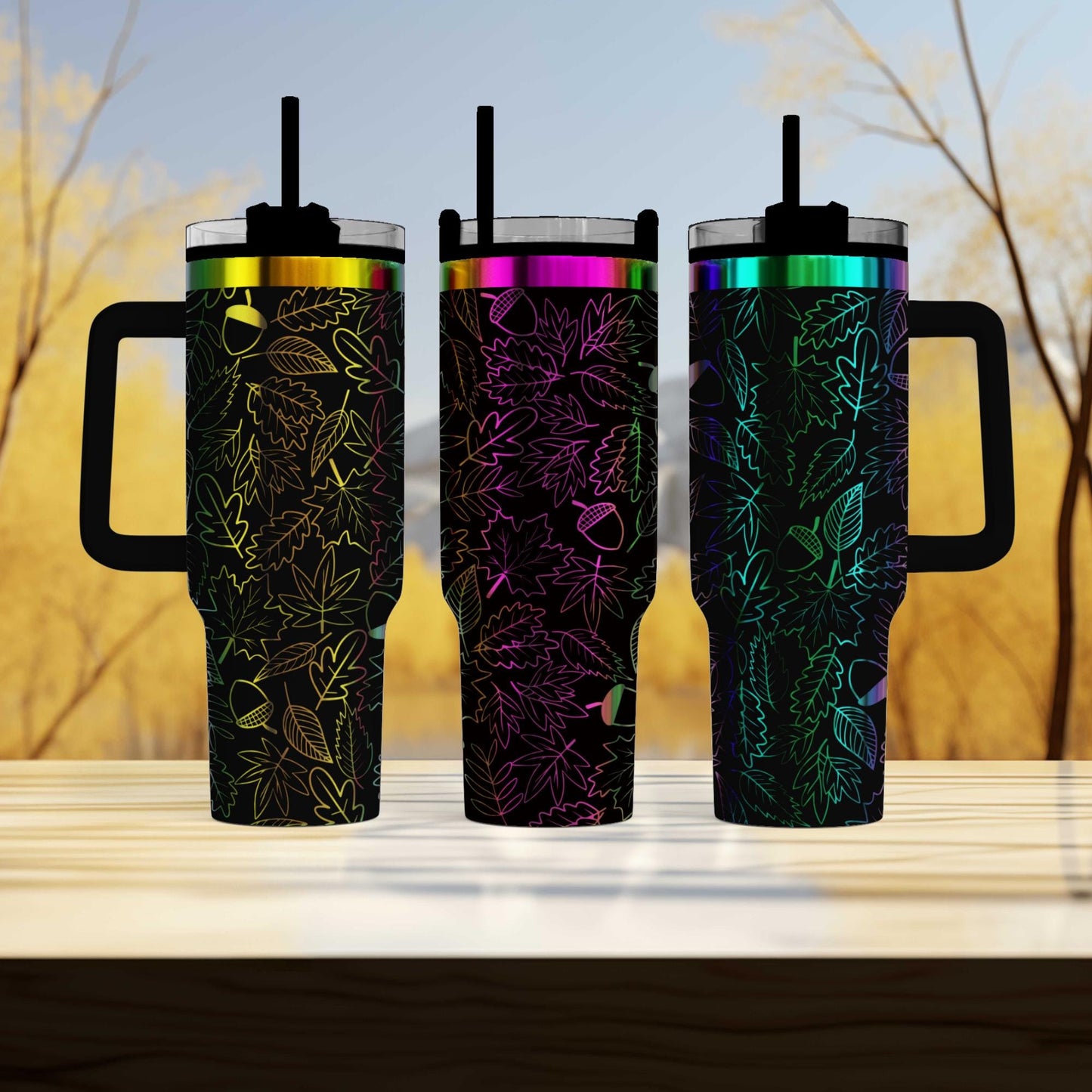 three travel mugs sitting next to each other on a table