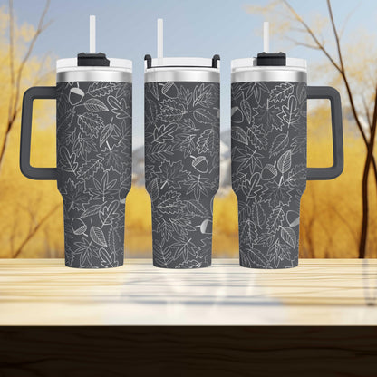three travel mugs sitting on top of a wooden table