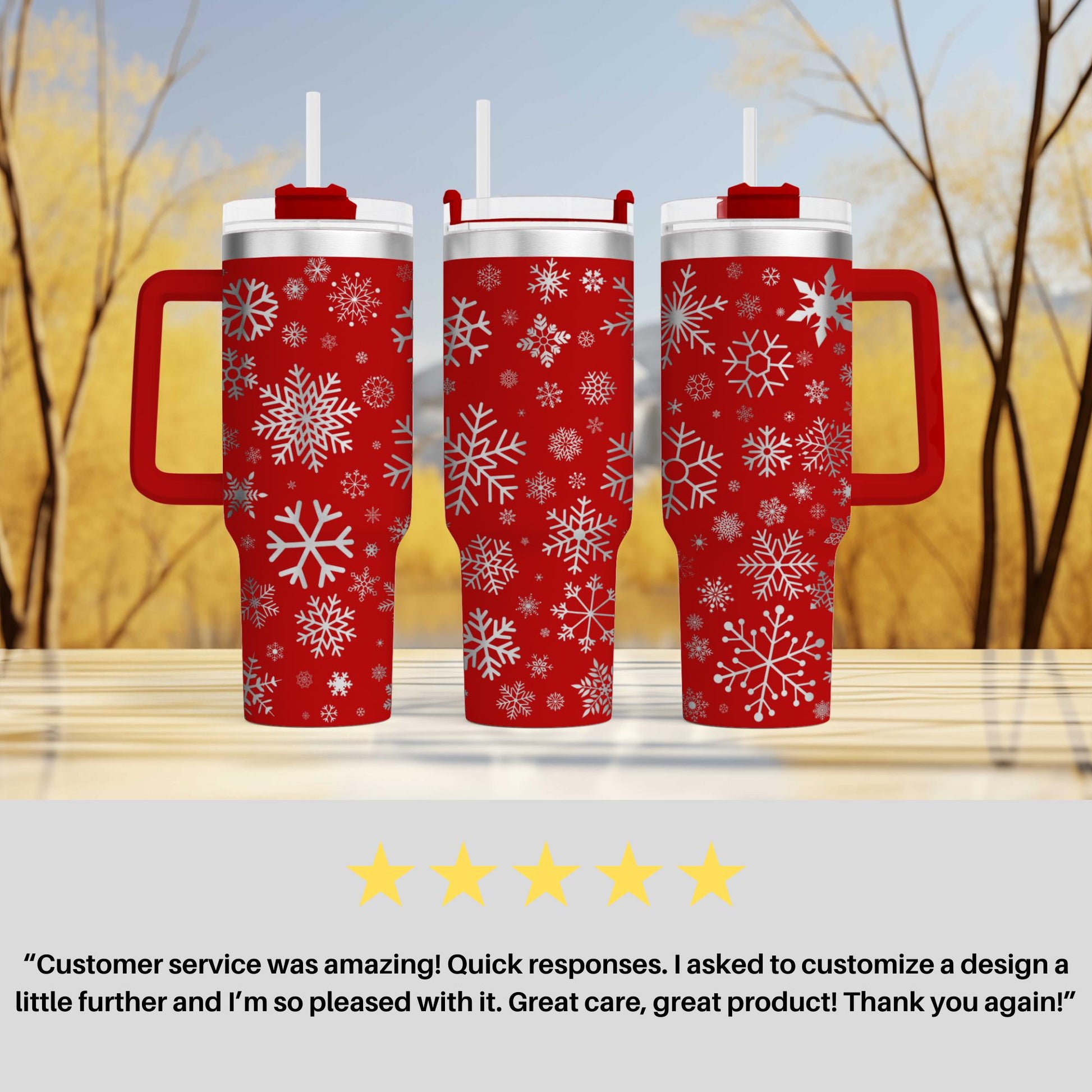 three red travel mugs with snowflakes on them