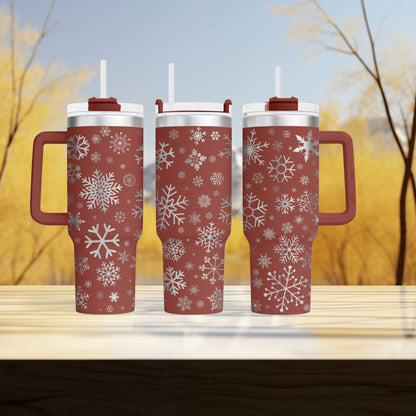 a couple of red cups sitting on top of a wooden table