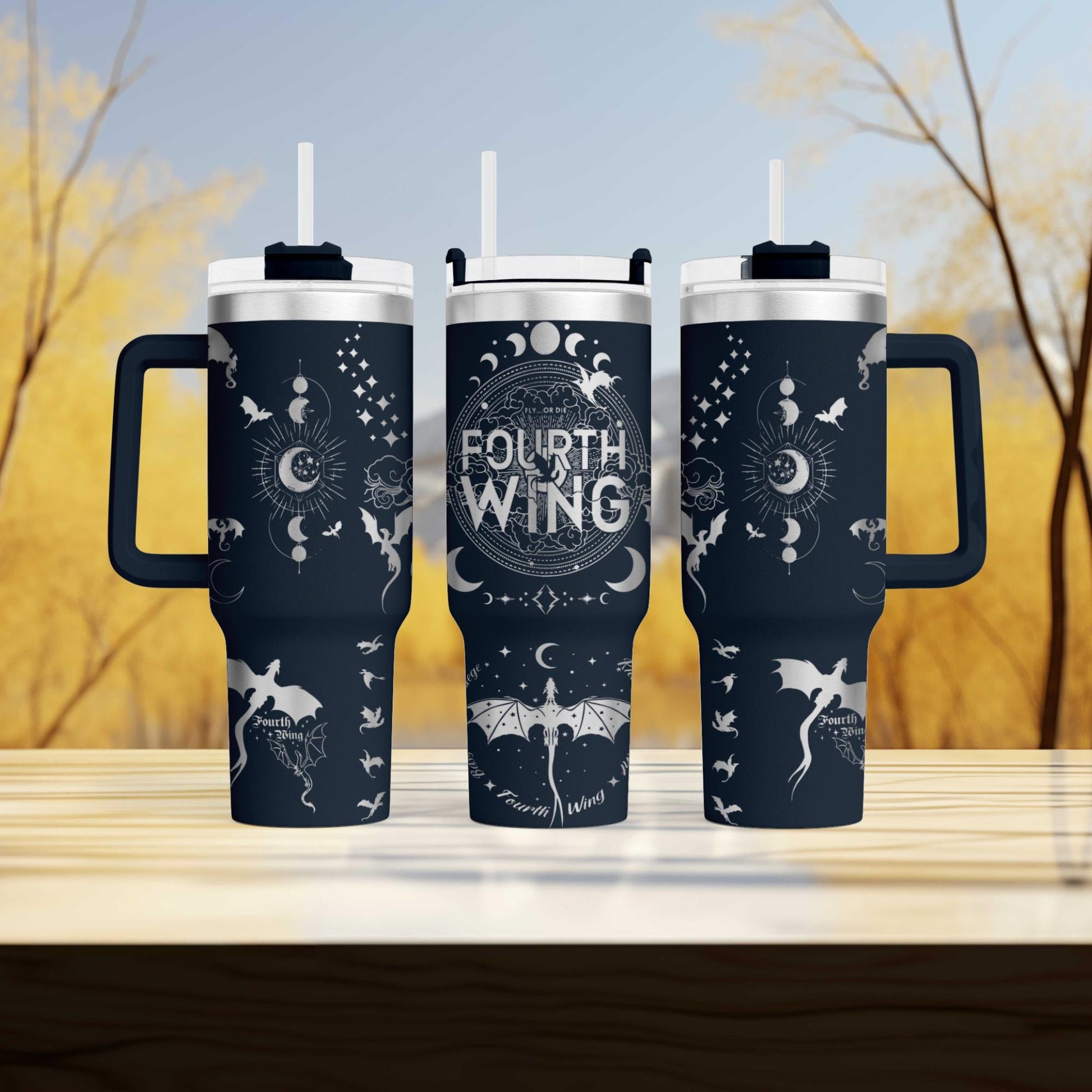 three travel mugs sitting on top of a wooden table