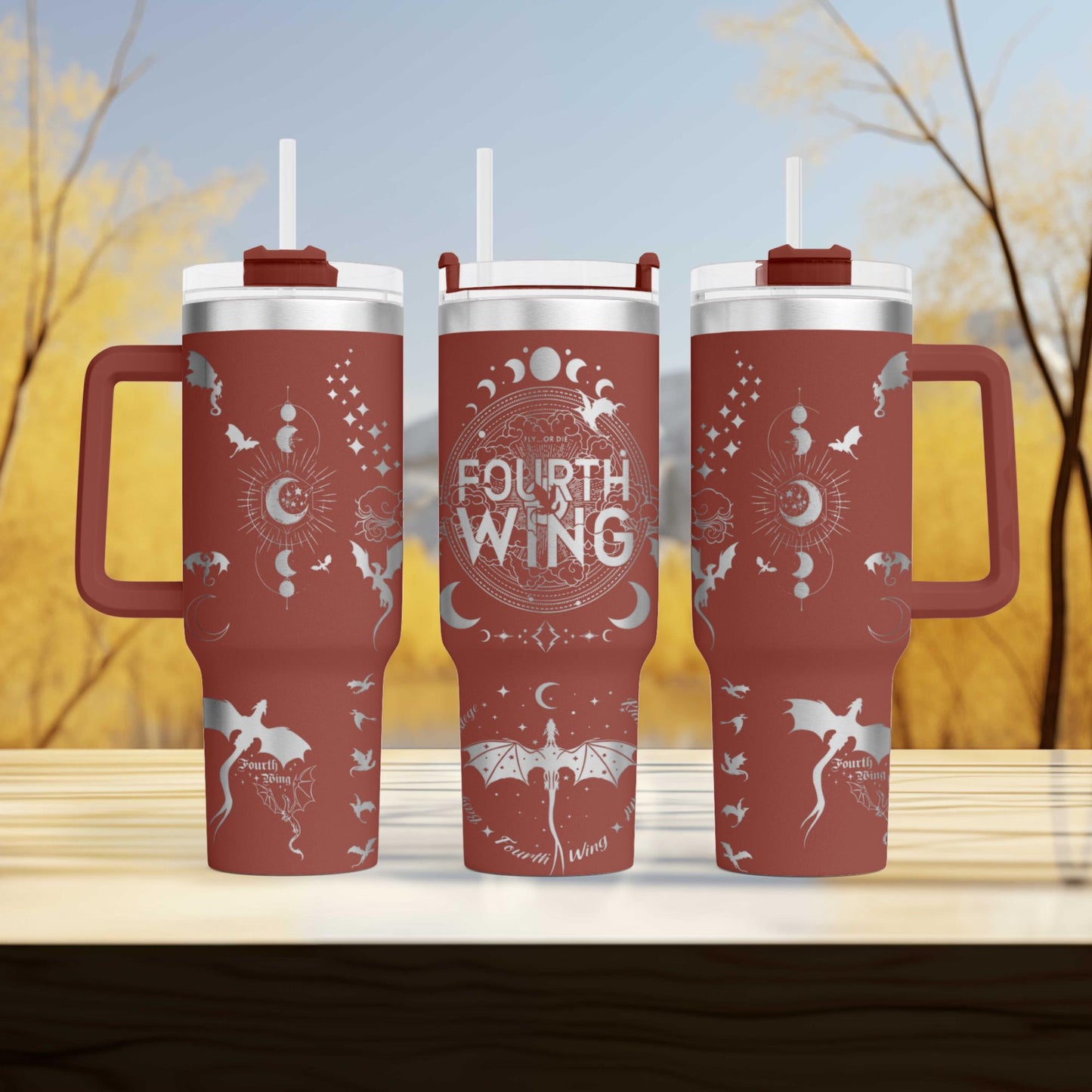 three red tumblers sitting on top of a wooden table