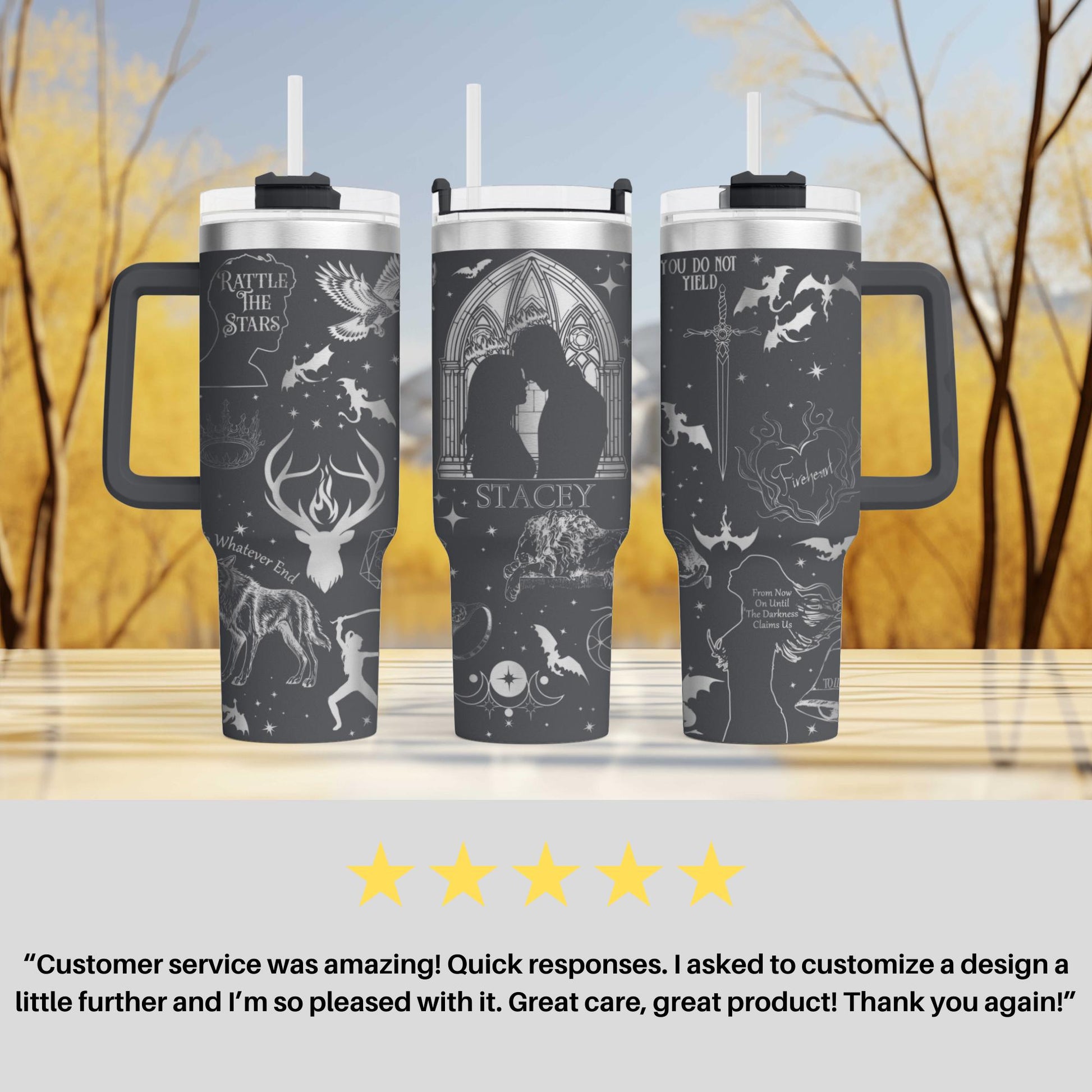 a couple of travel mugs sitting on top of a table