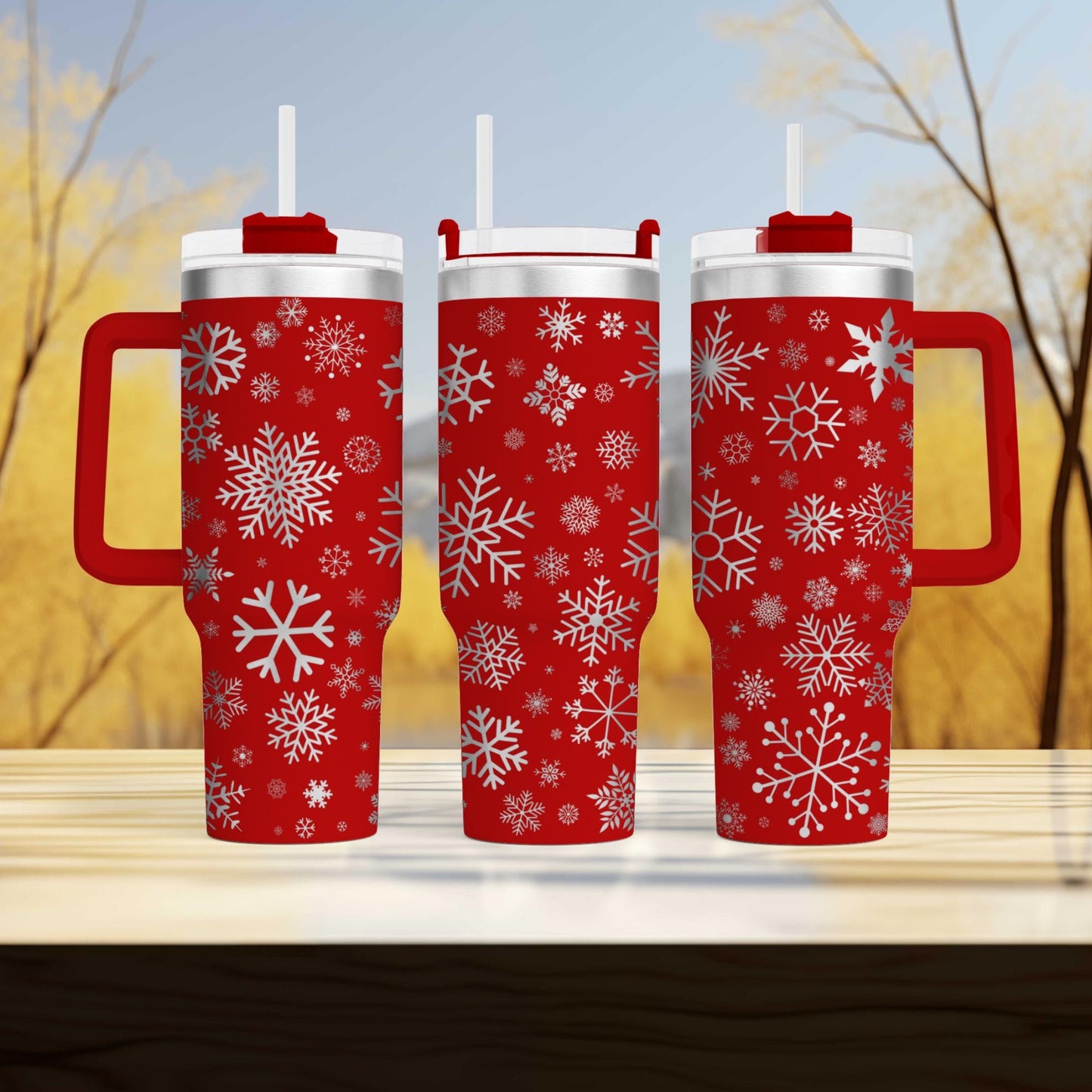 three red mugs with white snowflakes on them
