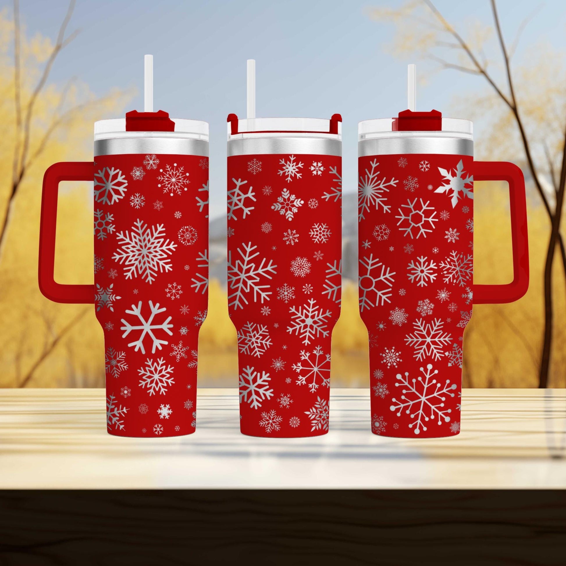 three red mugs with white snowflakes on them