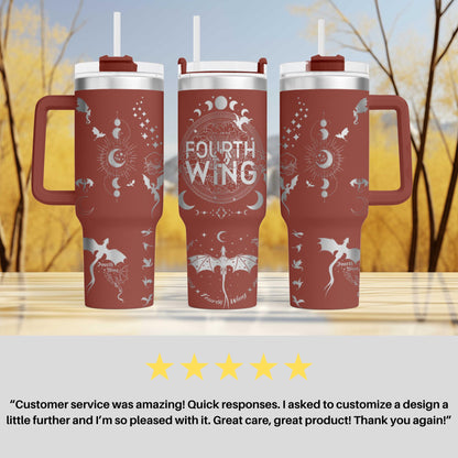 three red travel mugs sitting on top of a table