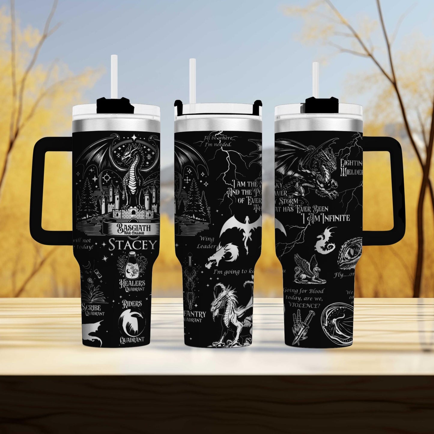 three travel mugs sitting on top of a wooden table