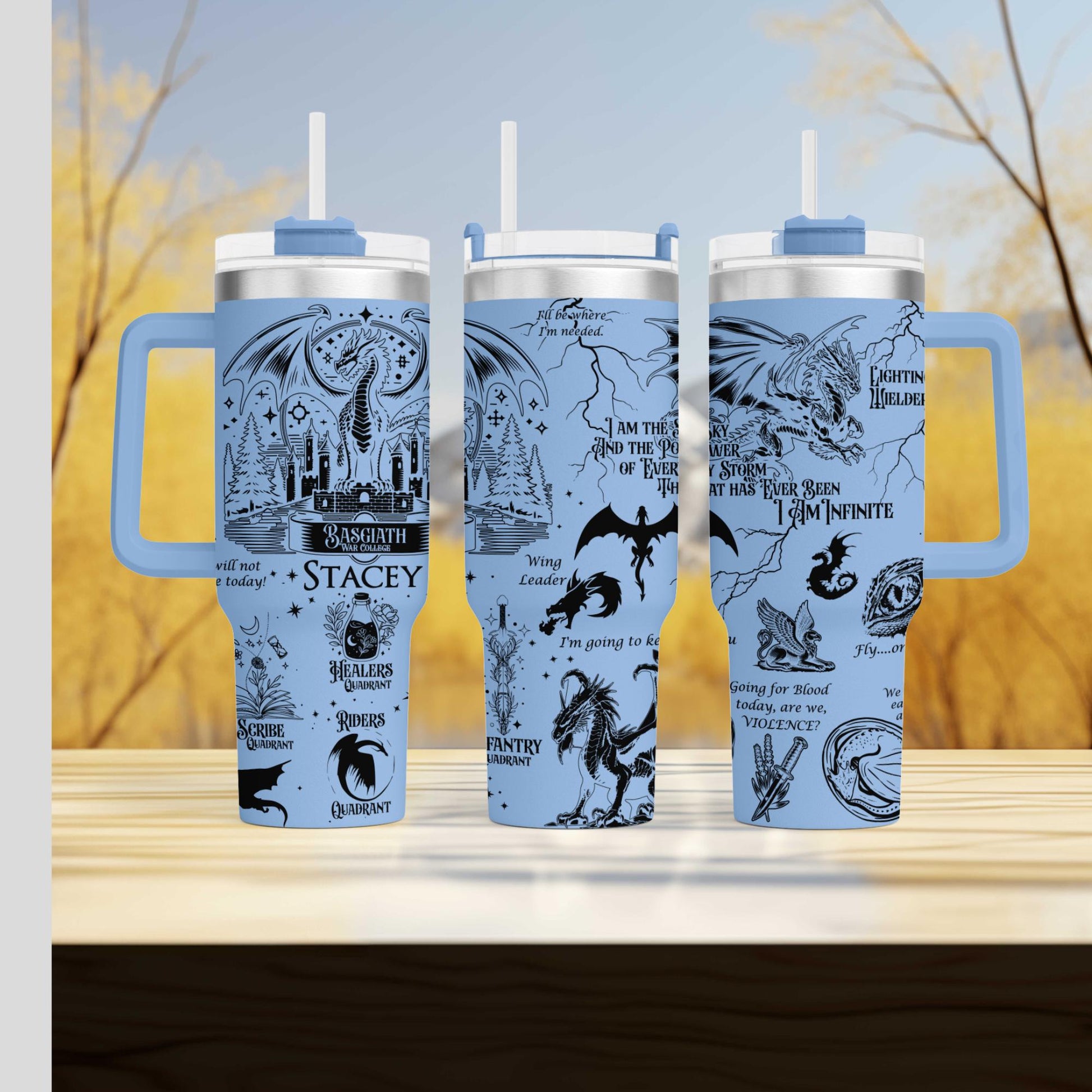 three travel mugs sitting on top of a wooden table