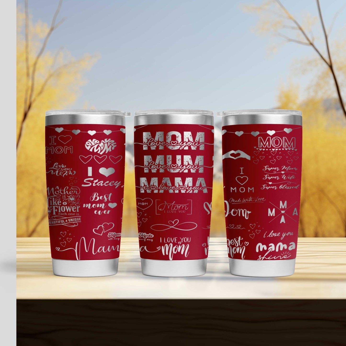 three red cups sitting on top of a wooden table