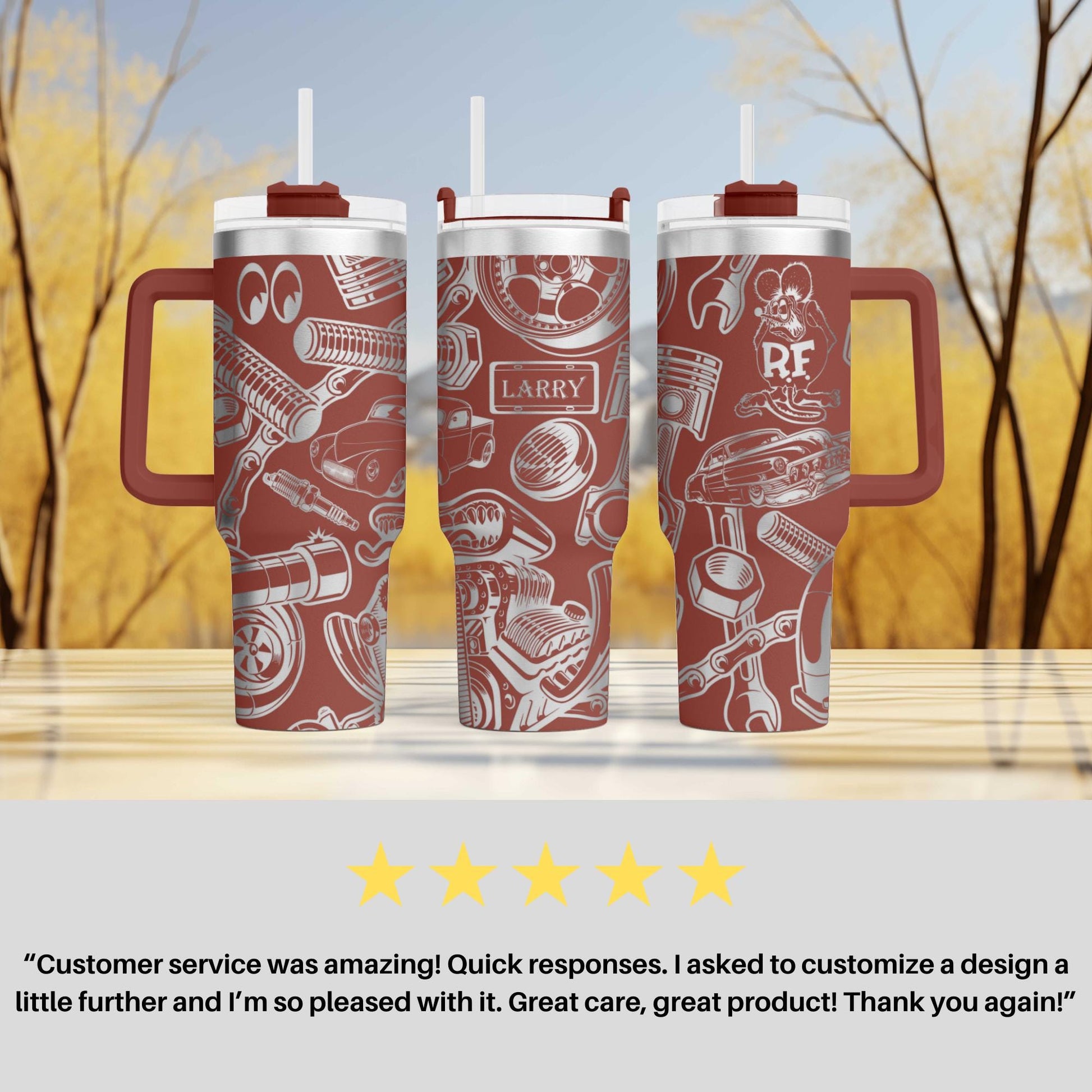 three red travel mugs sitting on top of a table