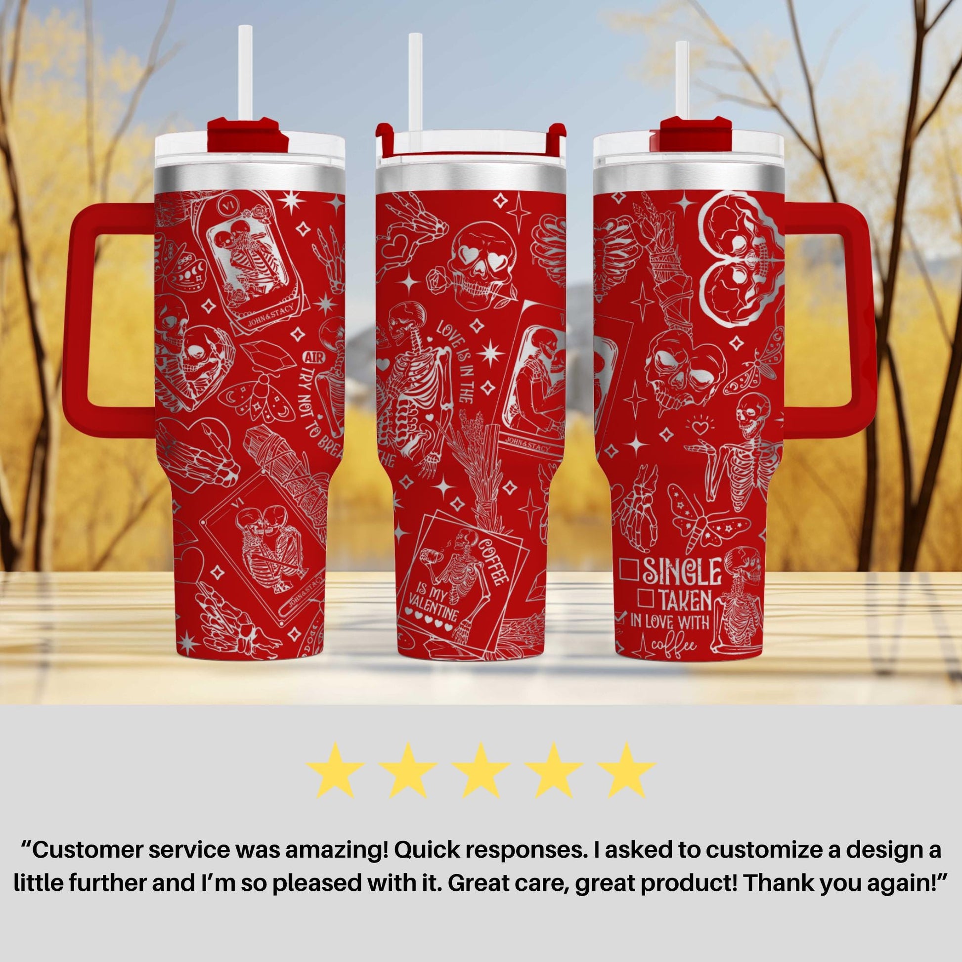 three red travel mugs sitting on top of a table