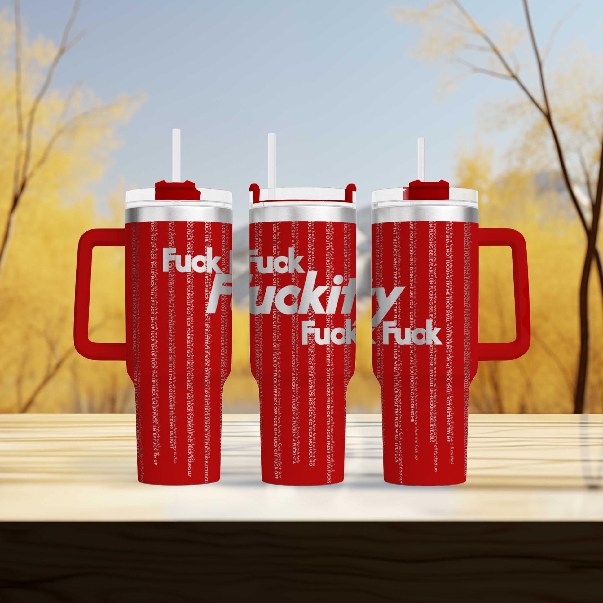 a couple of red cups sitting on top of a wooden table