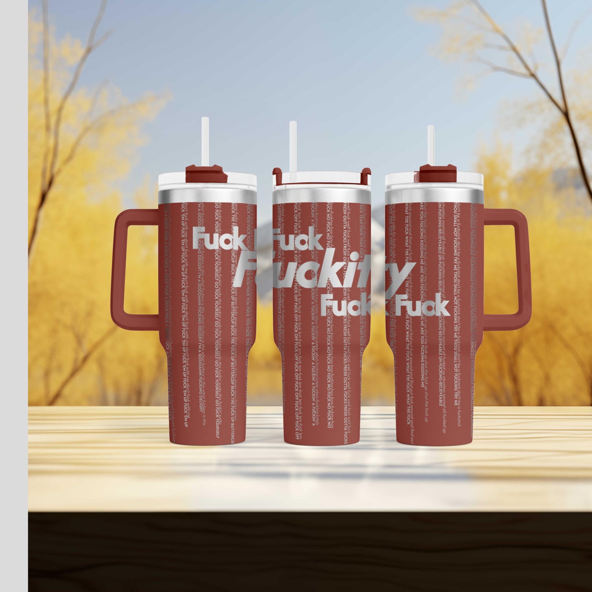 a couple of red cups sitting on top of a wooden table