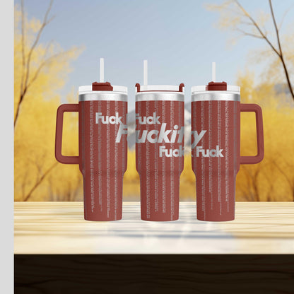a couple of red cups sitting on top of a wooden table