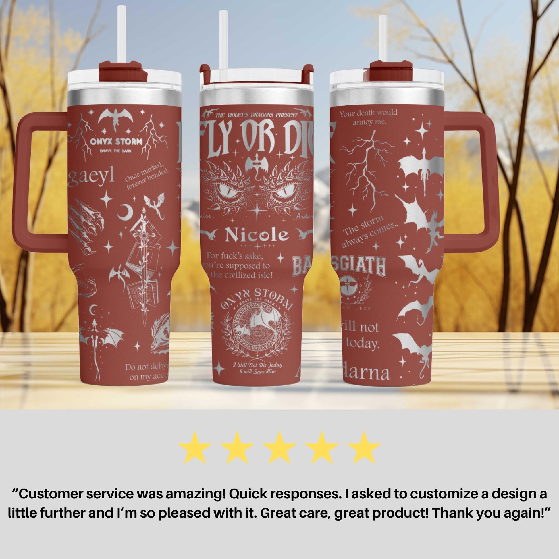 three red travel mugs sitting on top of a table