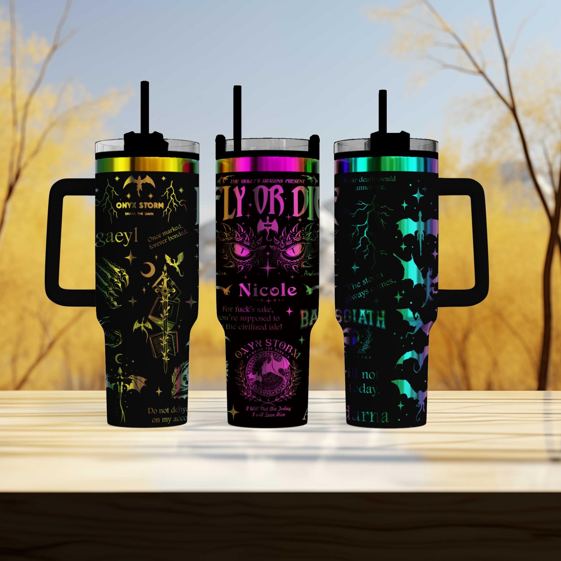 three travel mugs sitting on top of a wooden table