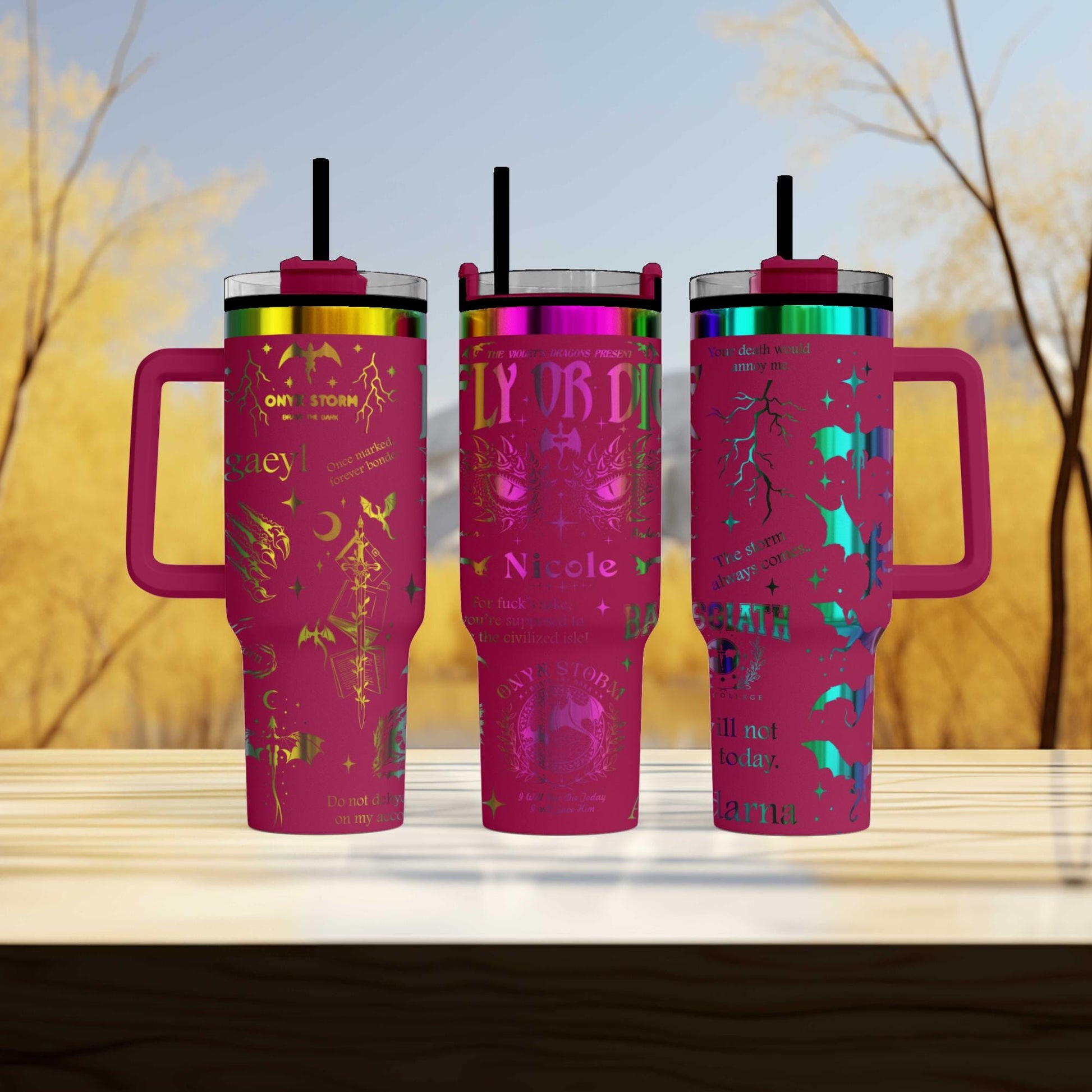 three travel mugs sitting on top of a wooden table