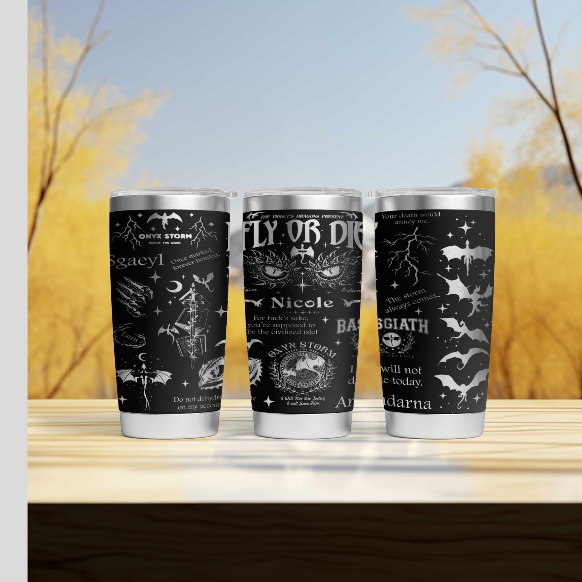 three tumblers sitting on top of a wooden table