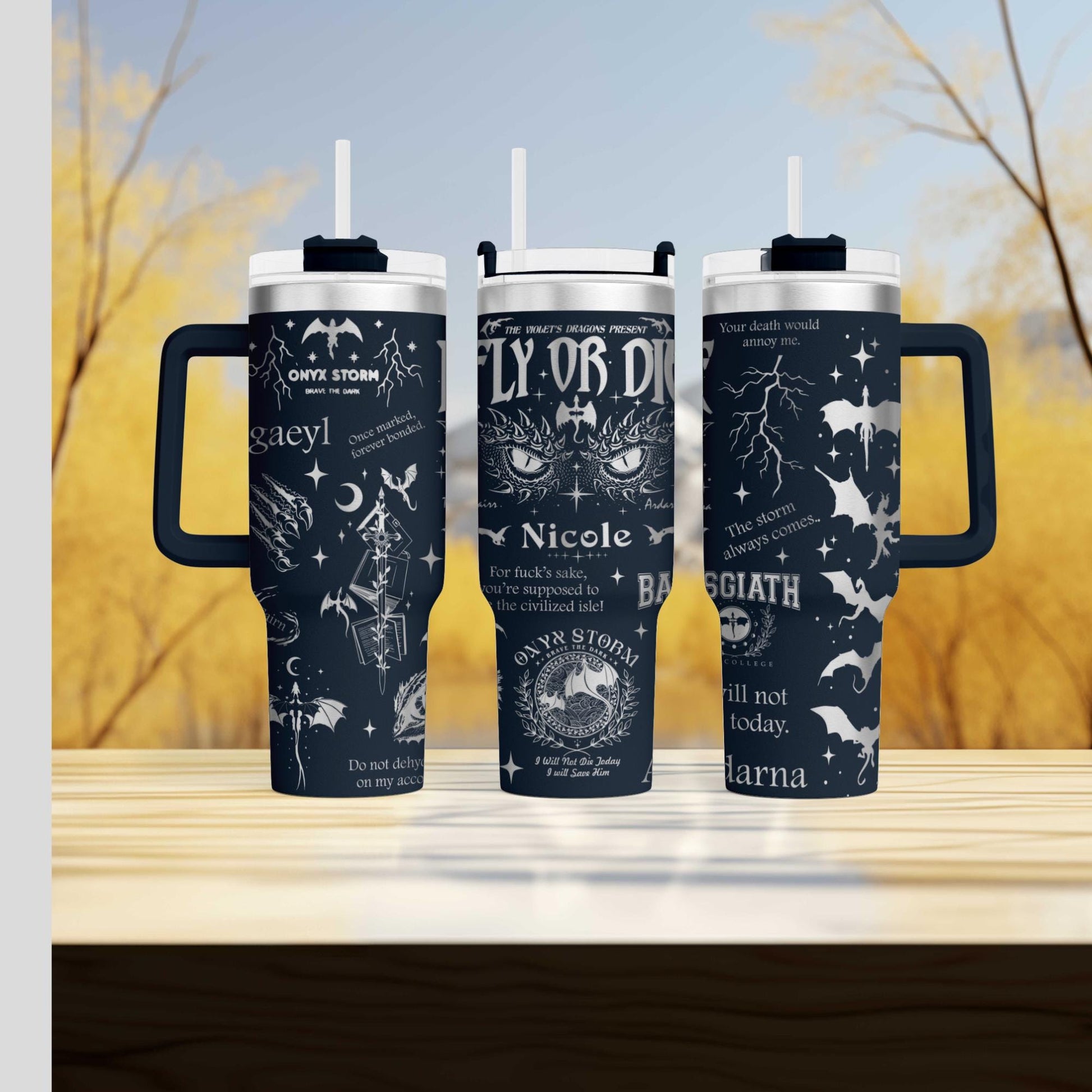 three travel mugs sitting on top of a wooden table