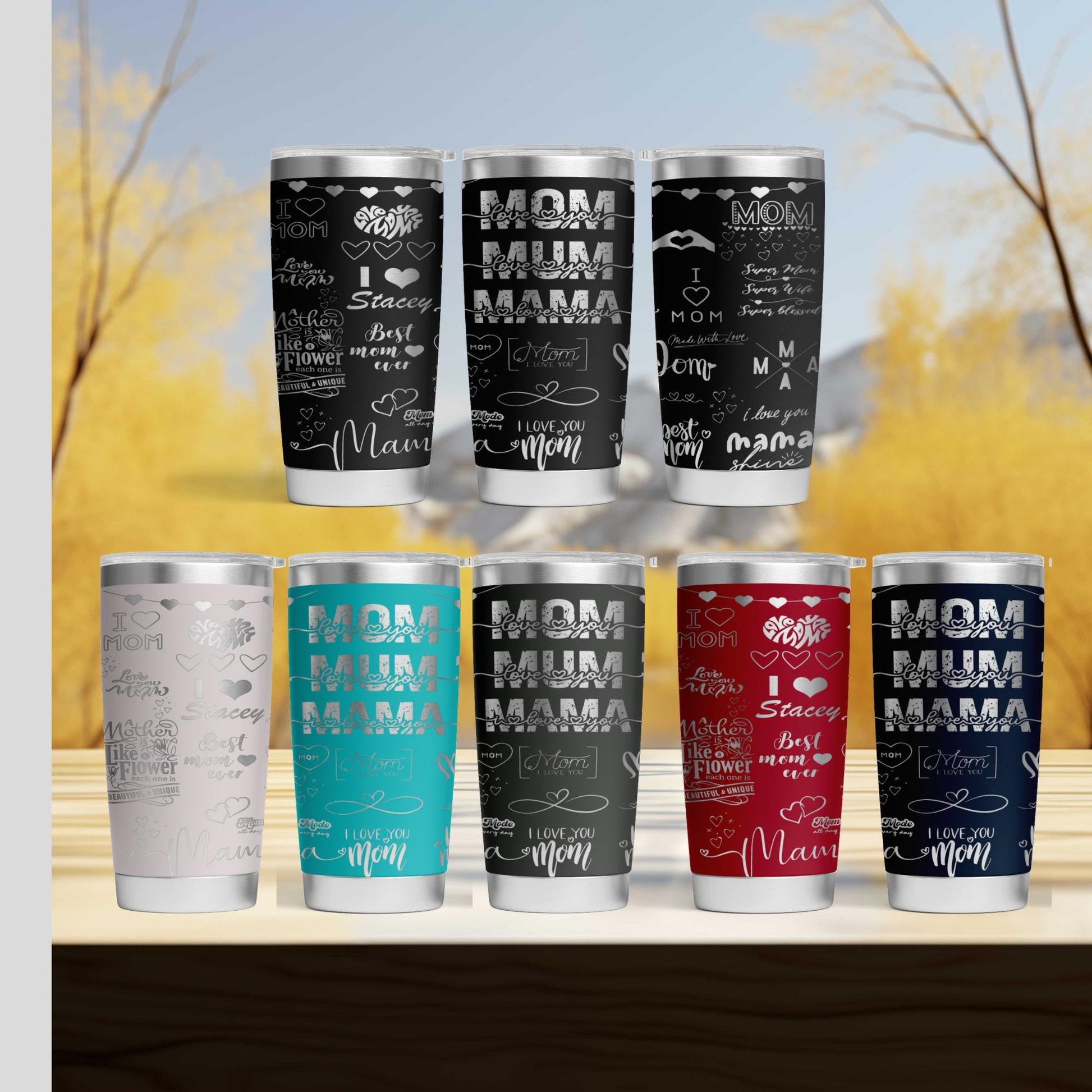 a set of six different colored cups sitting on top of a wooden table