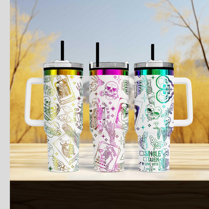 a group of three travel mugs sitting on top of a wooden table