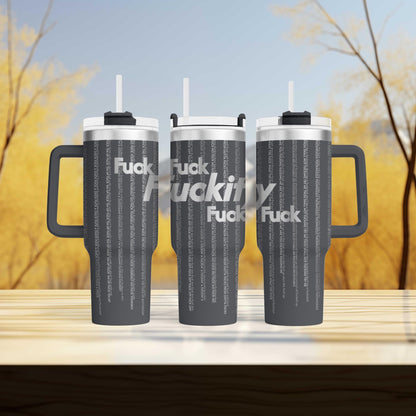 a couple of travel mugs sitting on top of a wooden table